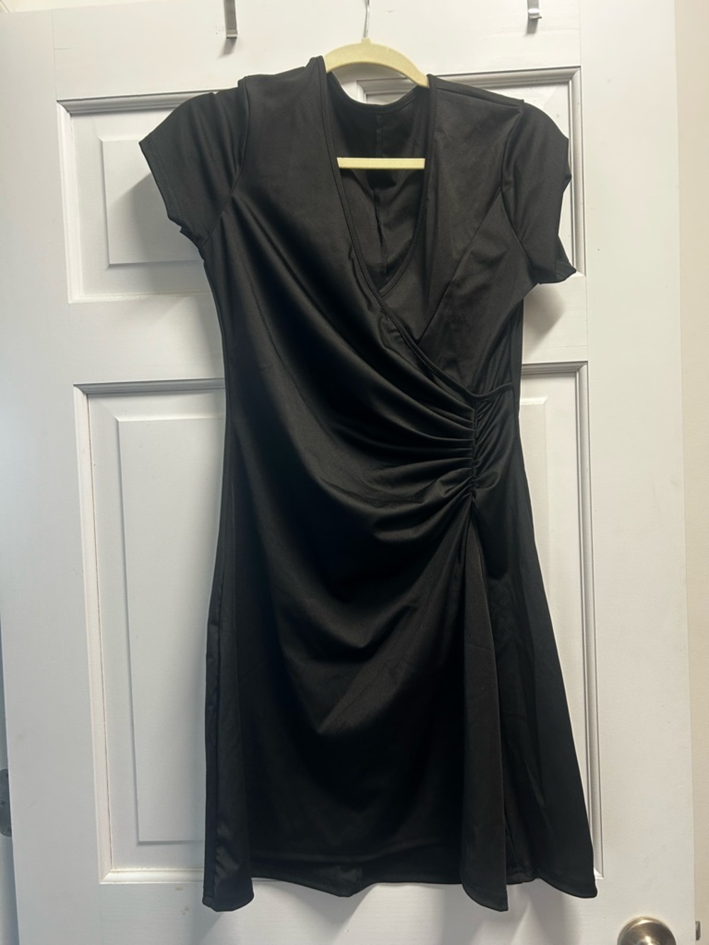 Sleek Black Ruched Wrap-Style Mini Dress